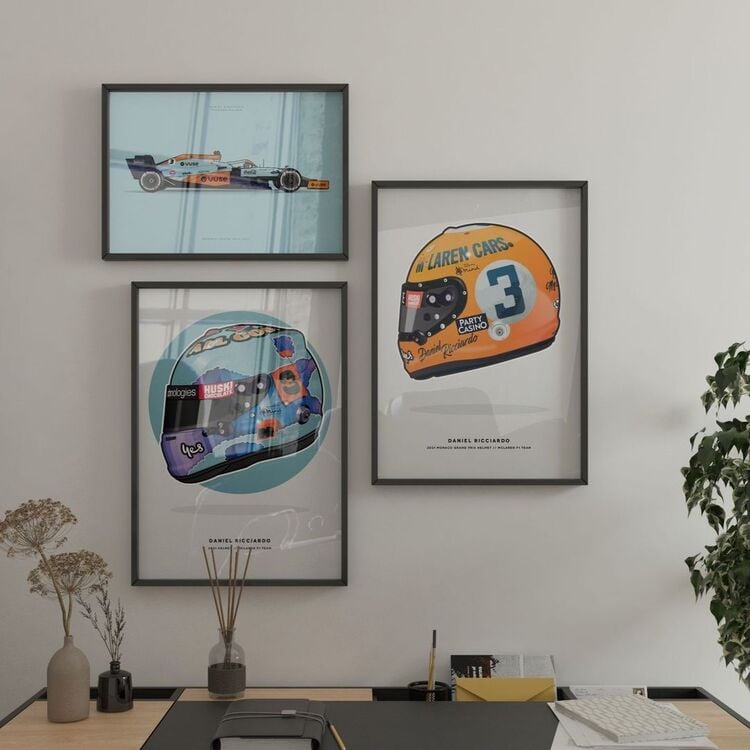 A simple wall decoration based on Mclaren and Daniel Ricciardo. There are three mclaren f1 posters, two posters of a racing helmet and one with the mclaren f1 car livery.