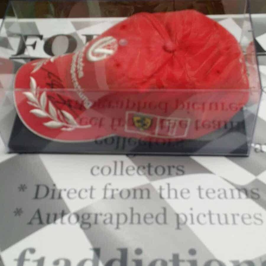 NOW SOLD - Schumacher signed Ferrari cap in perspex case. F1 Accessories