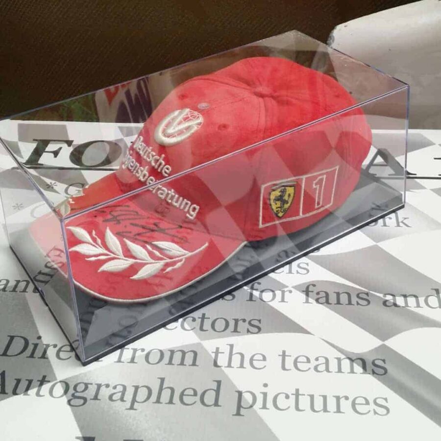 NOW SOLD - Schumacher signed Ferrari cap in perspex case. F1 Accessories